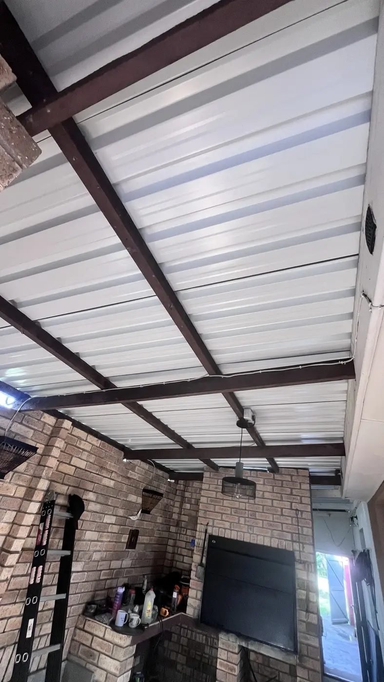 Patio with new white roof sheeting after renovation